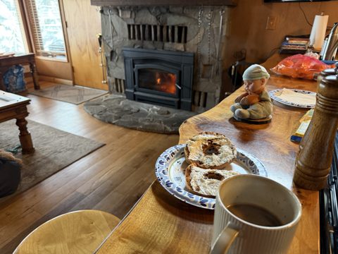 Lucy supervising and breakfast by the fire